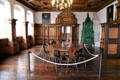 Green tile room stove & table & stools in Beautiful room saved from Pellerhaus at Fembohaus City Museum. Nuremberg, Germany.