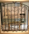 Ornamental iron grille with old German borders & Nazi slogan from Regensburg vehicle depot at Nuremberg Transport Museum. Nuremberg, Germany.