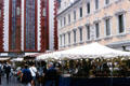 Busy market square with Marienkapelle in the background. Würzburg, Germany.