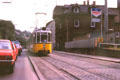 Street car with pantograph running along city street. Stuttgart, Germany.