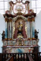 Side altar dedicated to St Francix Xavier surmounted by the Lamb of God, a common symbol for Jesus, at Liebfrauenkirche. Günzburg, Germany.