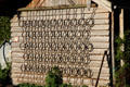 Antique chain field leveling device used as trellis on farm building in Chiemsee region. Chiemsee, Germany.
