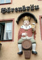 Brewery sign with king sitting on beer barrel. Füssen, Germany.