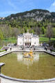 Pool with gilded fountain, Flora & Putti, in front of Linderhof Castle. Ettal, Germany.