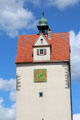 Clock and bell on tower overlooking town. Isny im Allgäu, Germany.