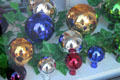 Display of shiny Christmas ornaments. Mittenwald, Germany.