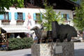 Horses & wagon commemorating Rott Strasse trade route, former Red Road between Venice & Augsburg which flourished during 15th & 16th C, bronze sculpture by Hubert Langmain. In Oberammergau goods were loaded on smaller carts destined for surrounding villages. Oberammergau, Germany.
