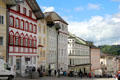 Sloped Marktstraße streetscape with colorful shops. Bad Tölz, Germany.