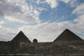 Pyramids of Chephren & Cheops flanking The Sphinx. Pyramids were only built for a short time because they were vulnerable to tomb robbers. Giza, Egypt.