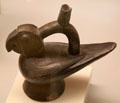 Moche ceramic stirrup-spout bottle in shape of parrot from Peru at Museum of America. Madrid, Spain.