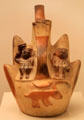 Moche ceramic vessel in shape of mountains & human sacrifice from Peru at Museum of America. Madrid, Spain.
