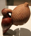 Chimu culture ceramic bottle with parrot eating fruit from Peru at Museum of America. Madrid, Spain.