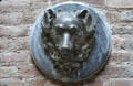 Dog medallion on wall of horse stables under Palau Güell. Barcelona, Spain.