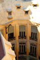 Central courtyard well windows seen from roof of Casa Milà. Barcelona, Spain.