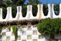 Mosaic walls flanking entrance steps of Parc Güell. Barcelona, Spain.