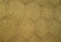 Modernista pressed tile pavement with spirals from Barcelona by Antoni Gaudí at Museu Nacional d'Art de Catalunya. Barcelona, Spain.