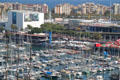 Pleasure craft at Port Vell with Imax theater & Barcelona Aquarium beyond. Barcelona, Spain.