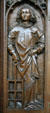 Oak choir stall carved with St Laurence in Unterlinden Museum. Colmar, France