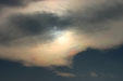 Sun reflects colors through thin layer of clouds. Colmar, France.
