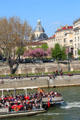 Flowering trees on banks of Seine opposite Île St Louis. Paris, France.