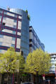 Modern facade of hotel & shopping area in Parc Bercy. Paris, France.