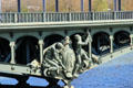 Blacksmith/Riveters sculpture by Gustave Michel fixed to side of Pont de Bir-Hakeim steel arch. Paris, France