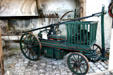 Fire pump carriage in coach collection at Vaux-le-Vicomte chateau. Melun, France.