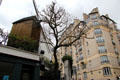 Blute-Fin Windmill home of Moulin de la Galette on Montmartre, now surrounded by apartments. Paris, France.