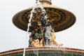 Fountain of Rivers upper section detail with figure holding trident by Jacques Ignace Hittorff in northern position on Place de la Concorde. Paris, France.