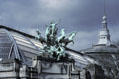Quadriga bronze statue of four horses pulling a god on chariot by Récipon atop Grand Palais. Paris, France.