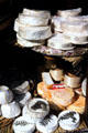 Round soft cheeses in shop. Paris, France.