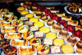 Rows of desserts at pastry shop. Paris, France