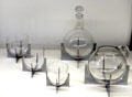 Elements of Paraison glass drinks service on chrome frames by Baccarat at Museum of Decorative Arts. Paris, France.