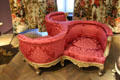 Circular chair for three in Second Empire style covered in silk damask by Benjamin Deguil & Benjamin-Paul Ramillon at Museum of Decorative Arts. Paris, France