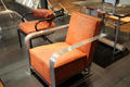 Armchairs office chair with black tubular arms by René Herbst & art deco chair with aluminum arms by Charlotte Alix & Louis Sognot at Museum of Decorative Arts. Paris, France.