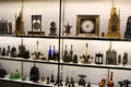 Collection of antique French clocks & other metal objects at Museum of Decorative Arts. Paris, France.