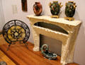 Fireplace by Hector Guimard with Havilland vases & fireplace screen at Petit Palace Museum. Paris, France.