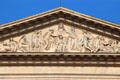 Bust of Louis XIV with Minerva, Muses & Victory pediment relief by François-Lemot on Colonnade of Louvre Palace. Paris, France.