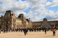 Courtyard with glass pyramid formed by Denon & Richelieu Pavilions at Louvre Museum. Paris, France.