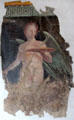 Roman fresco of winged genius holding platter buried at Boscoreale by eruption of Mount Vesuvius at Louvre Museum. Paris, France.