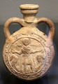 Clay flask with eulogy to Coptic St Menas from Egypt at Louvre Museum. Paris, France.