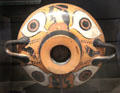 Greek terracotta black-figure drinking cup from Italy at Louvre Museum. Paris, France.