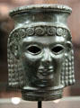 Bronze female head from Cyprus at Louvre Museum. Paris, France.
