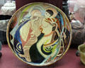 Glazed earthenware plate painted with blessing scene by Anne Dangar from Moly Sabata at Sèvres National Ceramic Museum. Paris, France.
