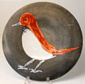 Ceramic plate painted with red bird by Pablo Picasso for Atelier Madoura at Sèvres National Ceramic Museum. Paris, France.