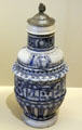 Blue & gray stoneware jug with arms of electors of Holy Roman Empire from Raëren, Germany at Sèvres National Ceramic Museum. Paris, France.