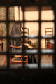 Reproduction of the 1793 cell of Marie-Antoinette as seen through bars with period furniture at Conciergerie. Paris, France.