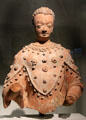 Earth sculpture of Buddha from Afghanistan at Guimet Museum. Paris, France.