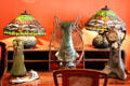 Dragonfly lamps & freeform glass vases & clock at Maxim's Art Nouveau Collection 1900. Paris, France.