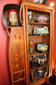 Art Nouveau display cabinet with ceramics at Maxim's Art Nouveau Collection 1900. Paris, France.